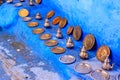 Colorful Moroccan fabrics and handmade souvenirs on the street in the blue city Chefchaouen, Morocco, Africa Royalty Free Stock Photo