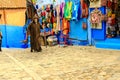 Colorful Moroccan fabrics and handmade souvenirs on the street in the blue city Chefchaouen, Morocco, Africa Royalty Free Stock Photo