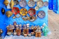 Colorful Moroccan fabrics and handmade souvenirs on the street in the blue city Chefchaouen, Morocco, Africa Royalty Free Stock Photo