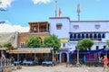 CHEFCHAOUEN, MOROCCO - MAY 29, 2017: Old buildings with cafe in the center of Chaouen. The city is noted for its buildings in Royalty Free Stock Photo