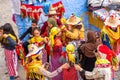 Chefchaouen, Morocco - November 4, 2019: A group of women try on shawls and hats in a store Royalty Free Stock Photo