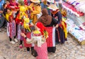 Chefchaouen, Morocco - November 4, 2019: A group of women try on shawls and hats in a store Royalty Free Stock Photo