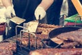 Cheff preparing delicious barbeque spare ribs on a grill. Royalty Free Stock Photo