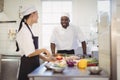 Chefs chopping vegetables in the commercial kitchen Royalty Free Stock Photo