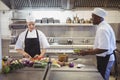 Chefs chopping vegetables in the commercial kitchen Royalty Free Stock Photo