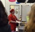 Chefs cook pancakes in front of customers