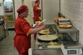 Chefs cook pancakes in front of customers