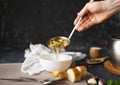 Chefs hand pour fresh hot soup in a white empty bowl, food preparations Royalty Free Stock Photo