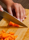 Chefs hands chopping carrot Royalty Free Stock Photo