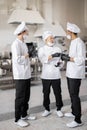 Chefs have some conversation in the professional kitchen at job Royalty Free Stock Photo