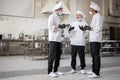 Chefs have some conversation in the professional kitchen at job Royalty Free Stock Photo