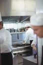 Chefs preparing food in the commercial kitchen Royalty Free Stock Photo