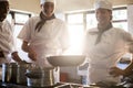 Chefs preparing food at stove Royalty Free Stock Photo