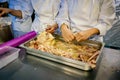Chefs processing meat in a professional kitchen Royalty Free Stock Photo