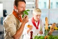 Chefs in a restaurant or hotel kitchen cooking Royalty Free Stock Photo