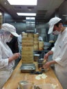 Chefs at work in a Chinese restaurant kitchen Royalty Free Stock Photo