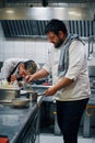 Two chefs working in professional kitchen Royalty Free Stock Photo