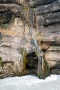 Chegemsky waterfall in Kabardino-Balkaria, Russia. Close-up of a large turbulent flow of water in the river.