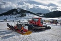 Cheile Gradistei, Romania - January 24: Snow-grooming machine on snow hill ready for skiing slope preparations in IBU