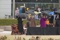 Chelsea Clinton waits on stage with U.S. Former First Lady Laura Bush and former first ladies Barbara Bush and Rosalind Carter dur