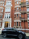 Chelsea district in London with luxury houses and cars and famous residents living here