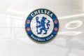 Chelsea fc on glossy office wall realistic texture Royalty Free Stock Photo