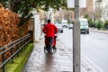 CHELSEA, LONDON, ENGLAND- 17th February 2021: Royal Mail postal worker pushing a post trolley