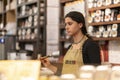 CHELSEA MARKET, NEW YORK CITY, USA - 21 July 2018: Sales woman in spices store in Chelsea Market