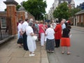 Chelsea pensioner talking to visitors., London, UK.