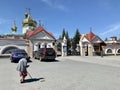 Chelyabinsk, Russia, June, 12, 2021. An elderly woman asks for alms in front of St. Simeon Cathedral in summer in clear weather