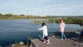 Kids feeding the bird in park in Chelyabinsk city in Russia