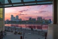 Citizens admire the sunset, which is reflected in the Miass river