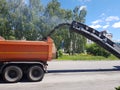 Chelyabinsk, Russia, may 29, 2020. Road repairs, cars clean the road from old asphalt