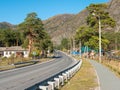 Chemal, Altai Republic, Russia - 10 October 2020: main road of the village of Chemal against the background of the Altai mountains Royalty Free Stock Photo