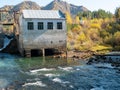 Chemal hydroelectric power station. Fishermen fish in the Katun River. Chemal, Altai Republic, Russia