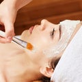 Chemic facial peel mask. Cosmetology acne treatment. Young girl at medical spa salon. Brush. Face fruit acid. Sensitive peeling Royalty Free Stock Photo