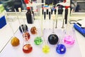 Chemical analysis, pharmacology and laboratory concept. Flasks with colored liquid reagents in a science laboratory Royalty Free Stock Photo