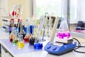 Chemical analysis, pharmacology and laboratory concept. Flasks and scales with colored liquid reagents in a science laboratory