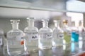 Chemical containers on the shelf in the laboratory. Chemistry, lab, chemicals