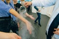 Chemical event at the birthday party: children's hands touch the smoke from liquid nitrogen
