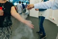 Chemical event at the birthday party: children's hands touch the smoke from liquid nitrogen