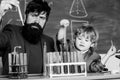 Chemical experiment. Genius minds. Genius toddler private lesson. Teacher child test tubes. Genius kid. Achieving Royalty Free Stock Photo