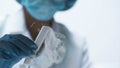 Chemical experiment, researcher holding test tube with boiling fuming liquid