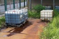 Chemical factory plastic container leaking pollution, leak rusty spill Royalty Free Stock Photo