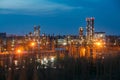 Chemical factory at summer night. Rectification towers Royalty Free Stock Photo