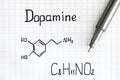 Chemical formula of Dopamine with pen. Royalty Free Stock Photo