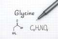 Chemical formula of Glycine with black pen. Royalty Free Stock Photo