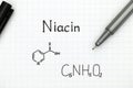 Chemical formula of Niacin with black pen