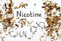 Chemical formula of Nicotine with spilled tobacco Royalty Free Stock Photo