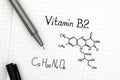 Chemical formula of Vitamin B2 with pen. Royalty Free Stock Photo